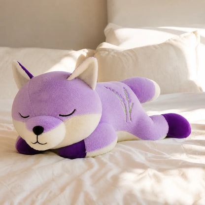 Lavender Sleepy Fox Plush on Cream Bed