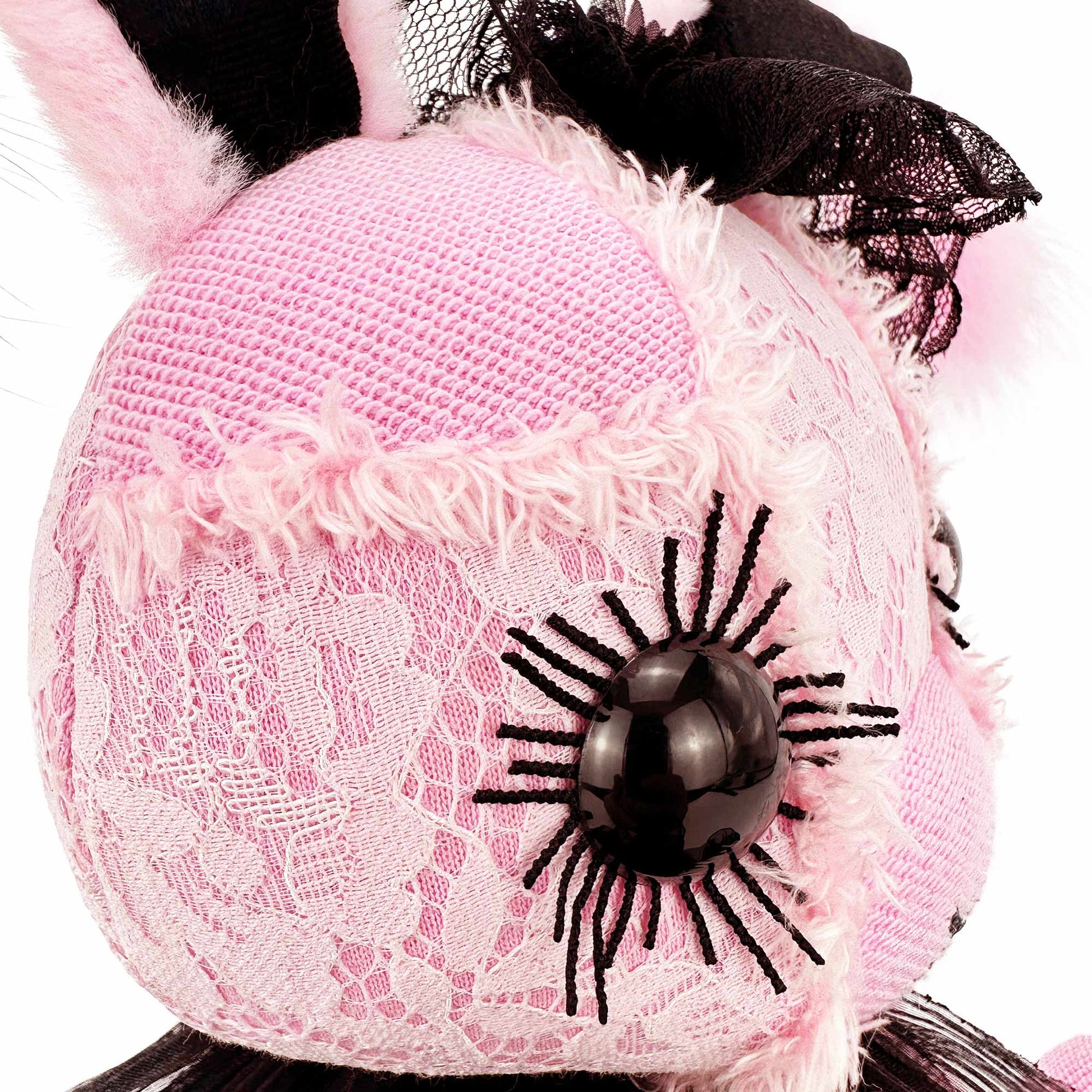 left side of pink bunny stuffed animal face