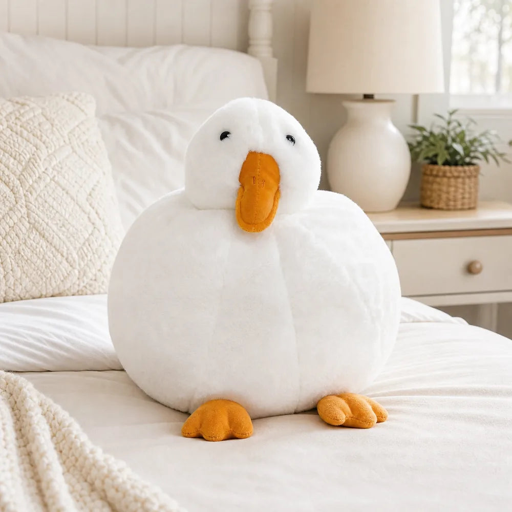 White Duck Plush on a Cream Bed