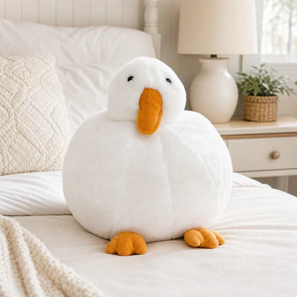 White Duck Plush on a Cream Bed