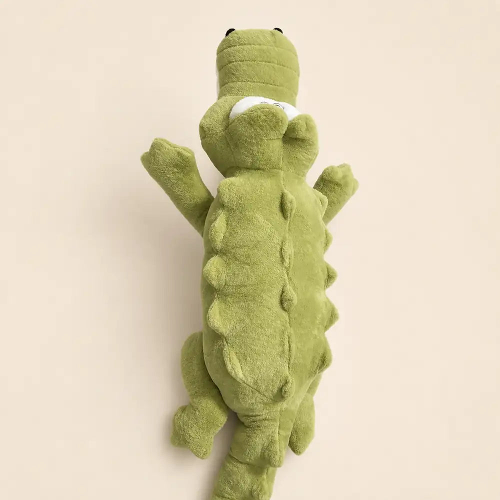 Light green 100cm crocodile plush back view on an ivory studio background