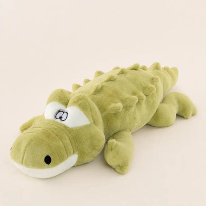 Light green 100cm crocodile plush side view on an ivory studio background