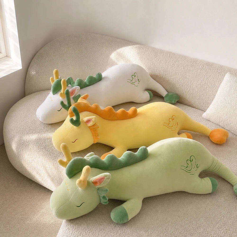 White Yellow and Mint Green Lovely Herbivore Dragon Plush Toys on a Cream Sofa