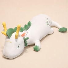 White and Green Lovely Herbivore Dragon Plush on a Beige Studio Background