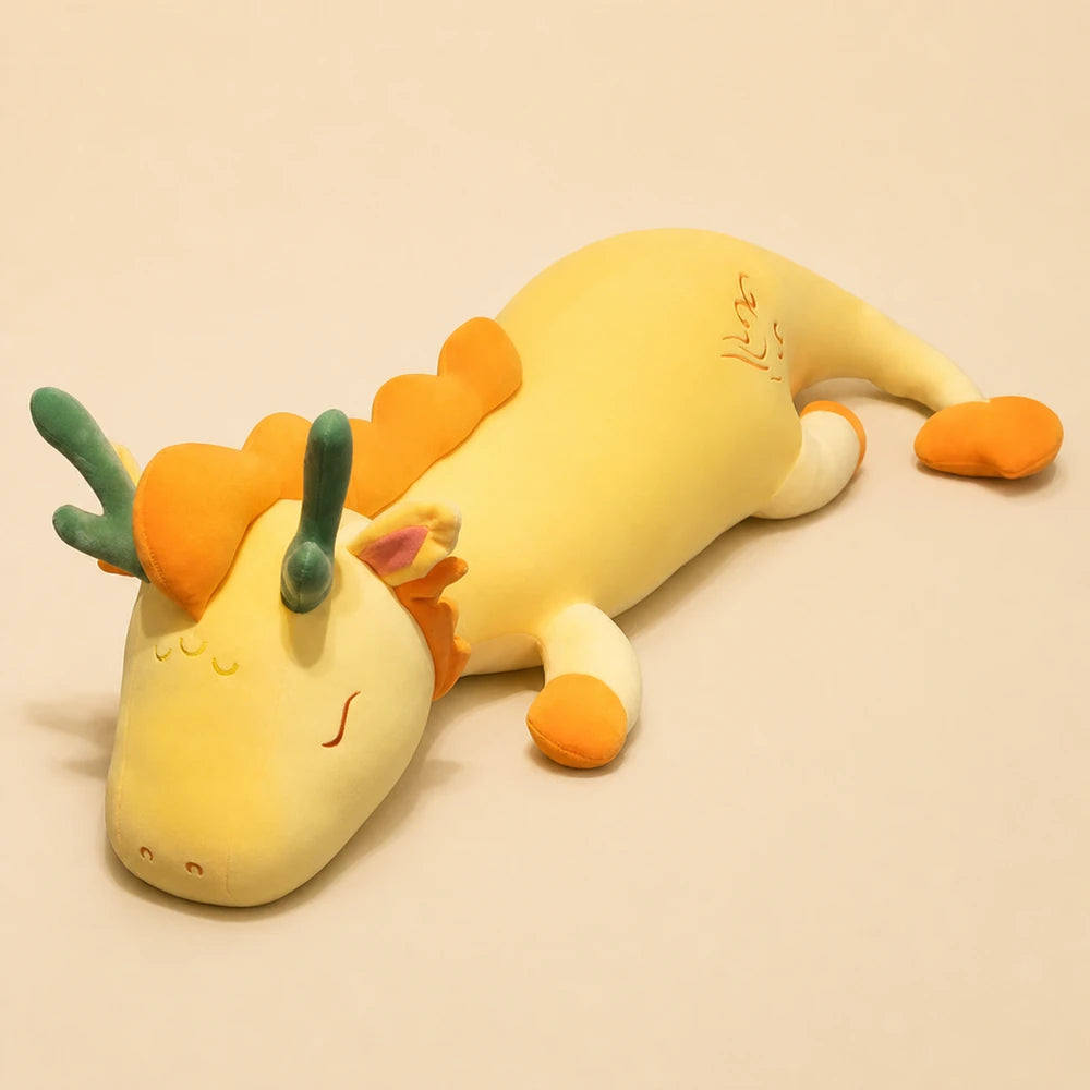 Yellow and Orange Lovely Herbivore Dragon Plush on a Beige Studio Background