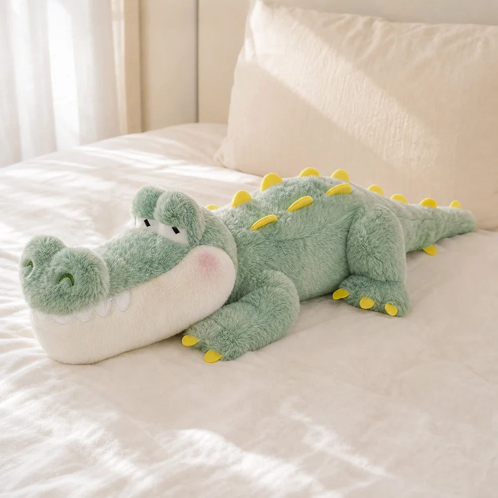 Mint green crocodile long pillow plush on a bright cream bed