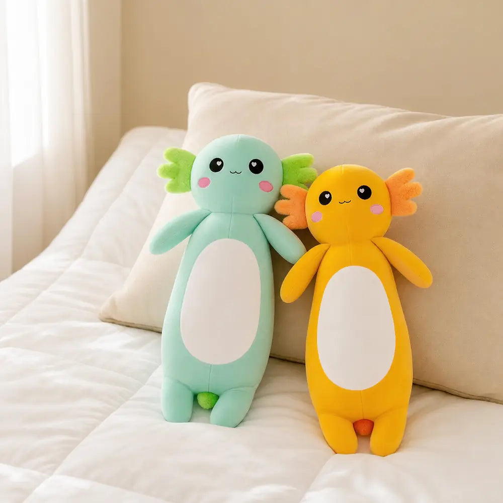 Mint Green and Yellow Long Axolotl Plush Toys on a Bed