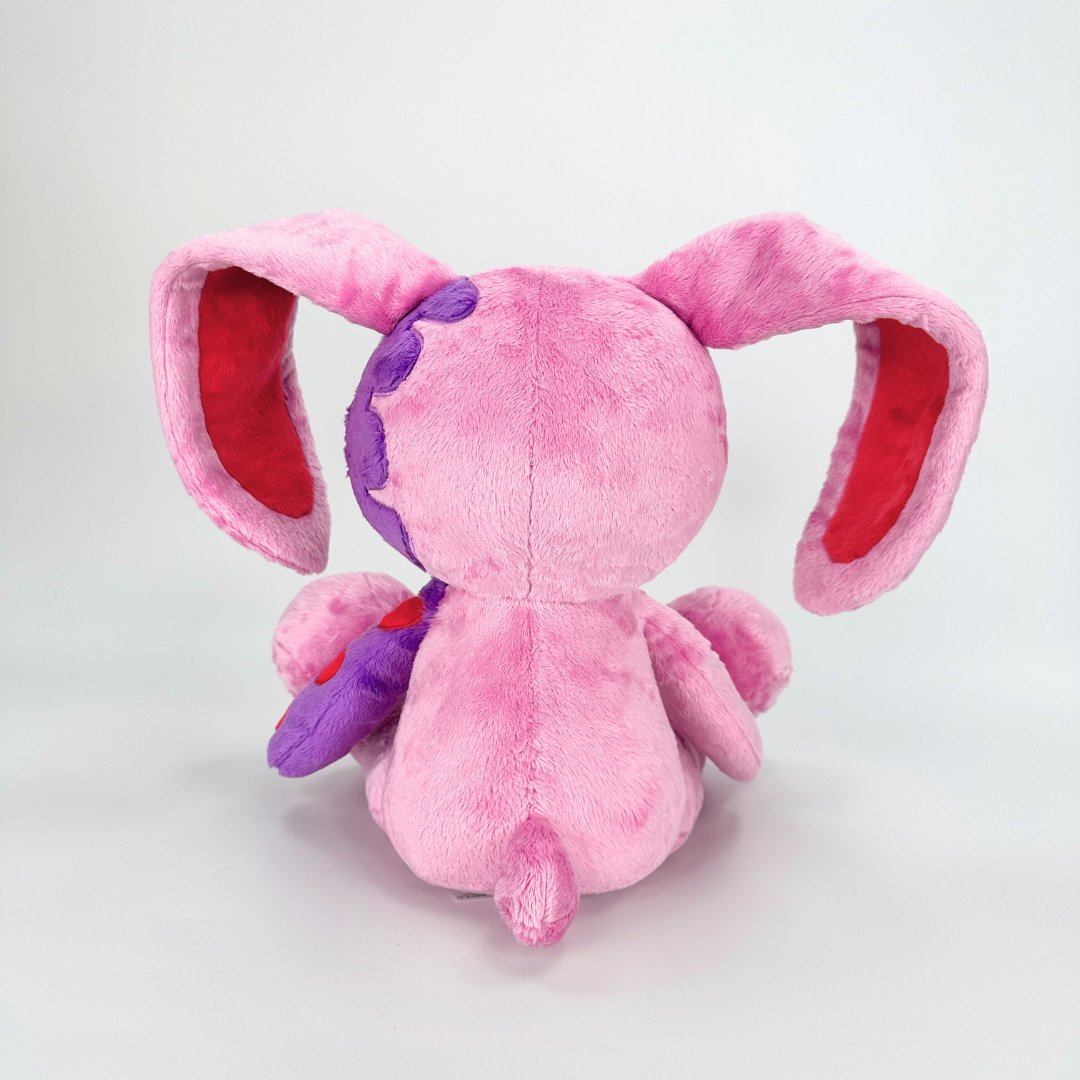 Emo, Pink, Purple, and Bunny plush toys