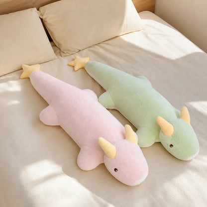 Pink and Mint Green Kawaii Dragon Plushes on a Bed