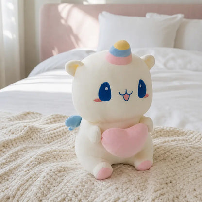 Pastel Heart Unicorn Plush on a Cozy Cream Bed
