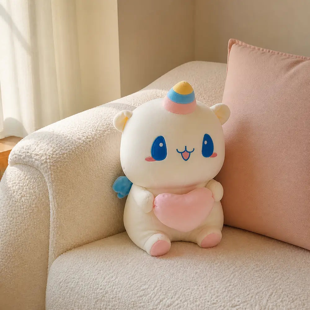 Pastel Heart Unicorn Plush on a Cream Sofa