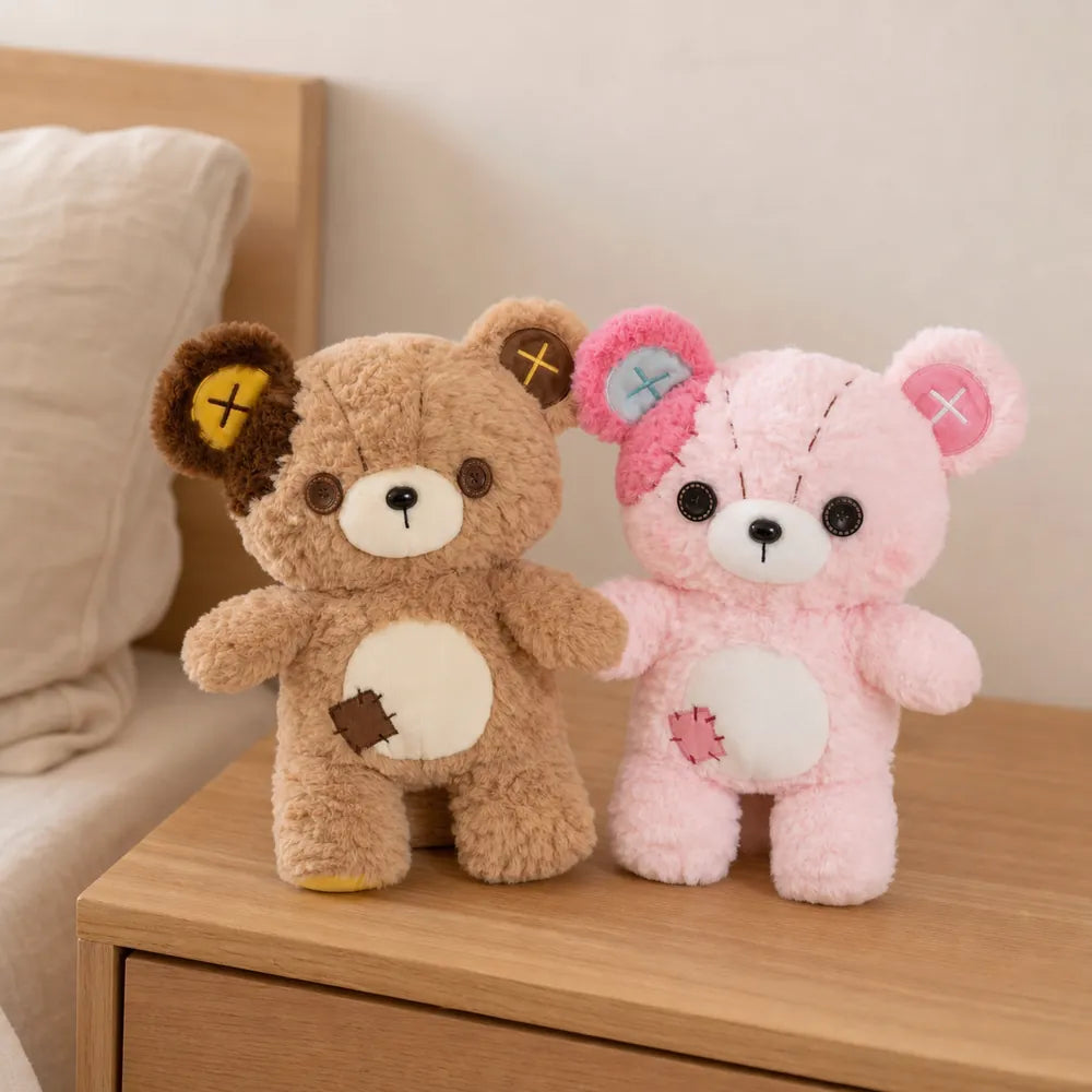 Tan and Pink Patchwork Teddy Bear Plush Pair on a Bedside Table