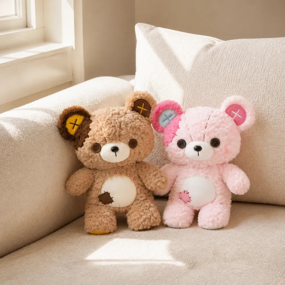 Tan and Pink Patchwork Teddy Bear Plush Pair on a Cream Sofa