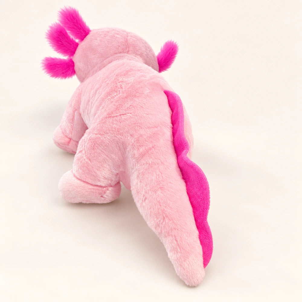 Rear view of the pink axolotl stuffed animal showing its long tail and bright pink tail fin.