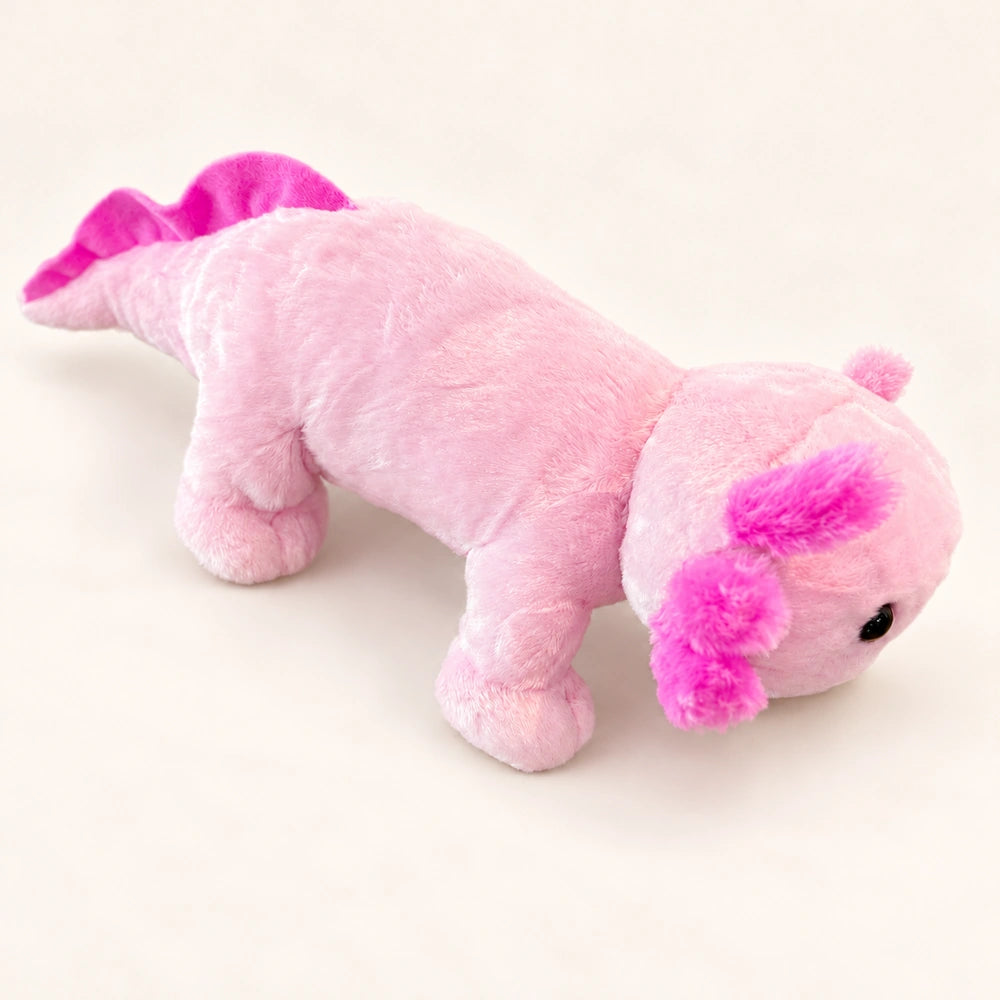 Side view of the pink axolotl stuffed animal showing its long body, short legs, and fluffy pink gills.