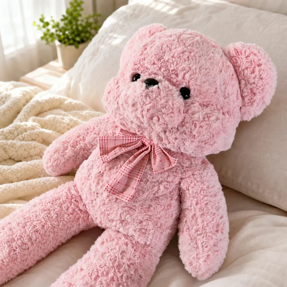 Pink Pastel Teddy Bear Plush on a Bed