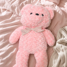 Pink Pastel Teddy Bear Plush on a Cozy Bed