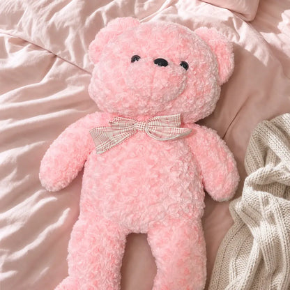 Pink Pastel Teddy Bear Plush on a Cozy Bed