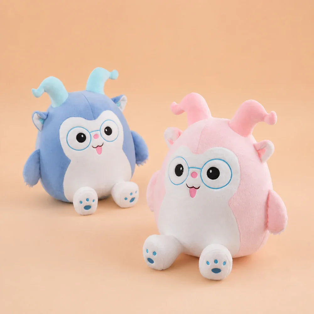Pink and Blue Glasses Plush Toys - Angled Pair on Warm Peach Studio Background