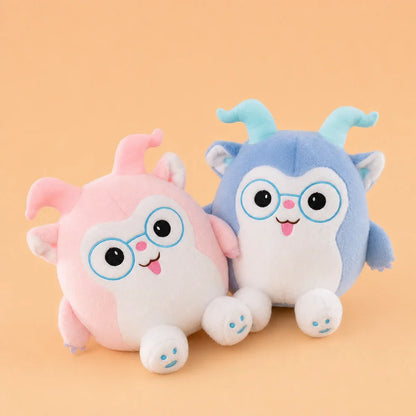 Pink and Blue Glasses Plush Toys - Pair on Warm Peach Studio Background