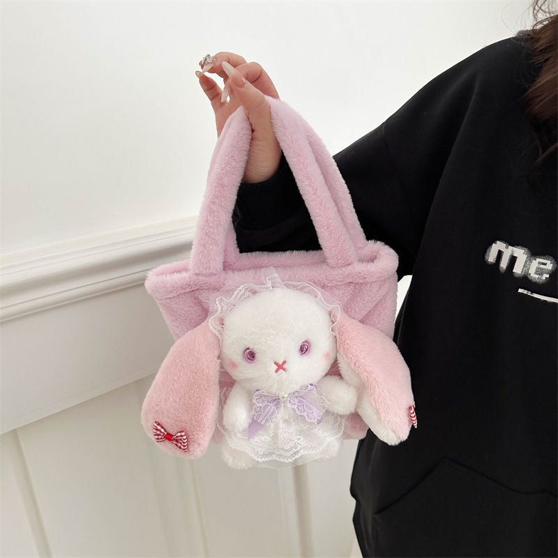 Pink bunny handbag with a lace bow and heart-shaped details