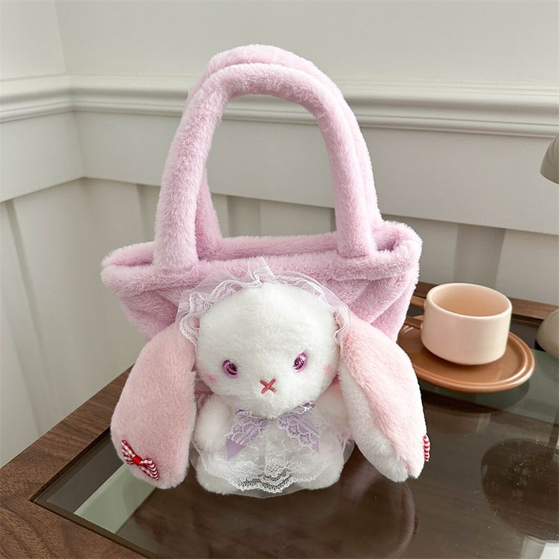 Pink bunny handbag with a lace bow and heart-shaped details