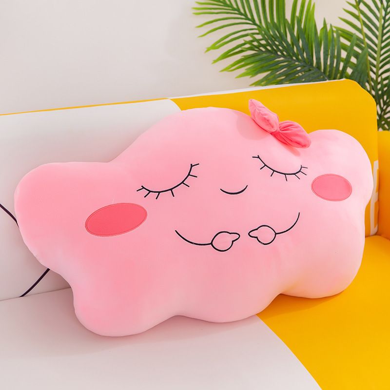 A cloud-shaped pink stuffed toy