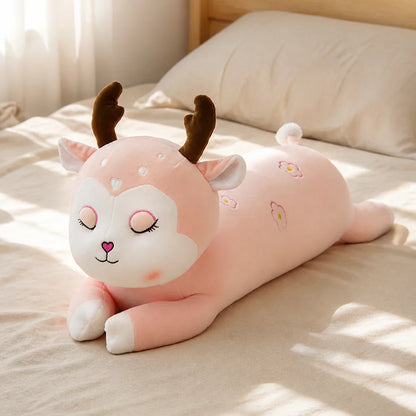 Pink Floral Deer Plush Body Pillow on a Bed