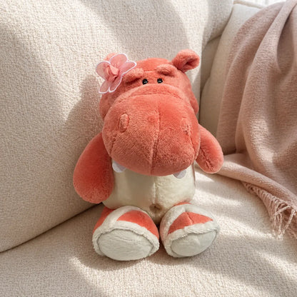 Pink Flower Hippo Plush on a Cream Sofa