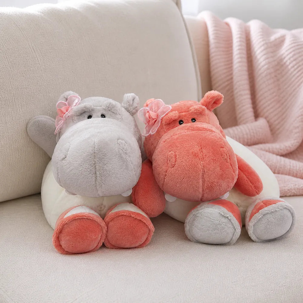 Pink and Gray Flower Hippo Plush on a Cream Sofa