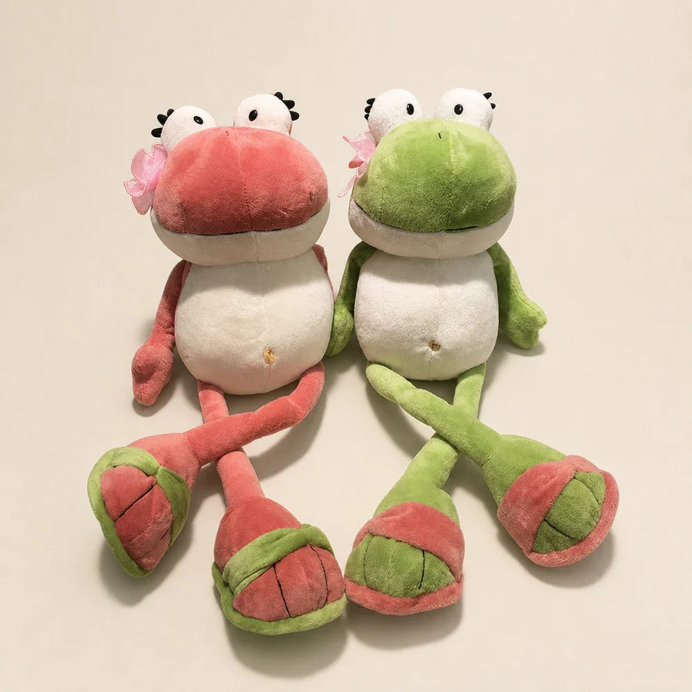 Pink and Green Frog Plush Toys - Crossed Legs View
