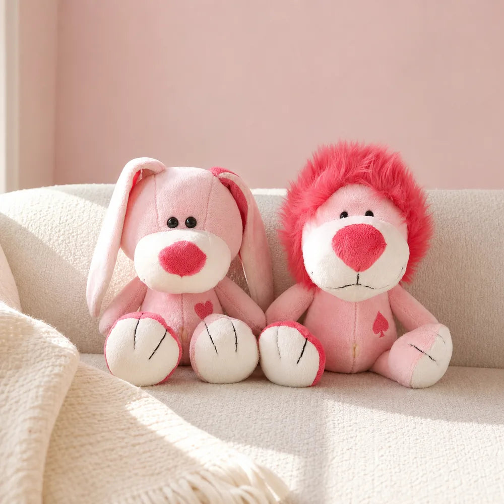 Pink Love Bunny and Lion Plush on a Cream Sofa