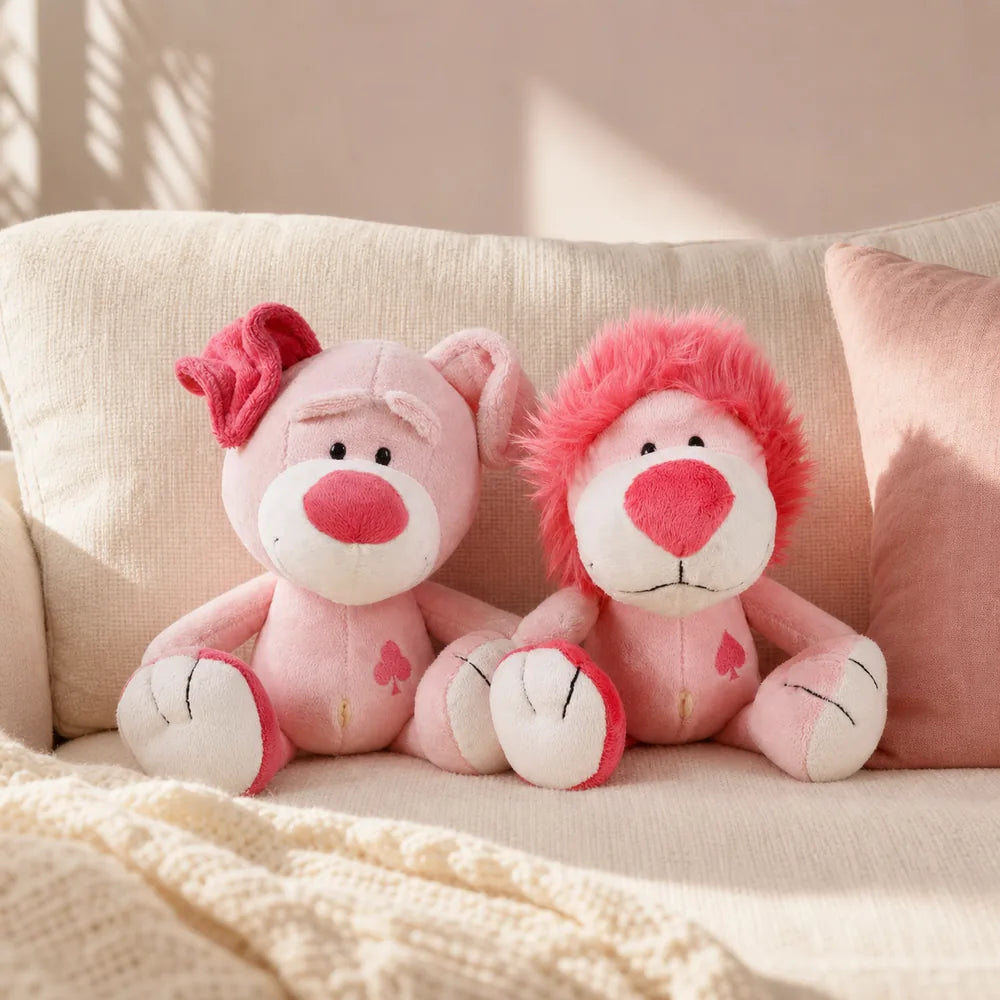 Pink Love Pig and Lion Plush on a Cream Sofa