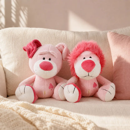 Pink Love Pig and Lion Plush on a Cream Sofa