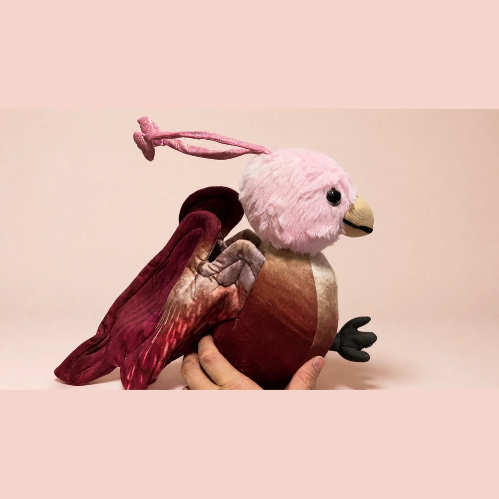 Pink Phoenix Plush - Side View on Warm Blush Studio Background