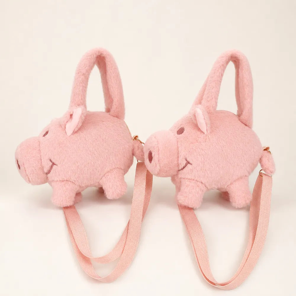Pink pig plush purse side view