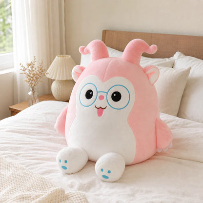 Pink Glasses Plush Toy on a Cozy Bed