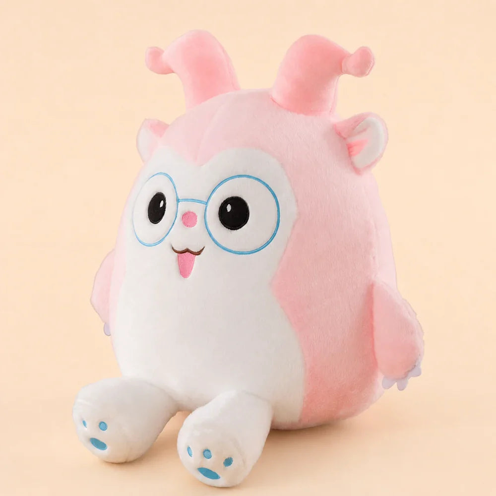 Pink Glasses Plush Toy - Three Quarter View on Warm Peach Studio Background