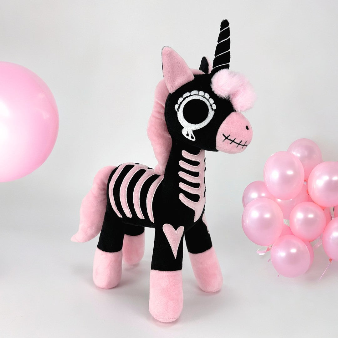 Pink skeleton unicorn plush toy