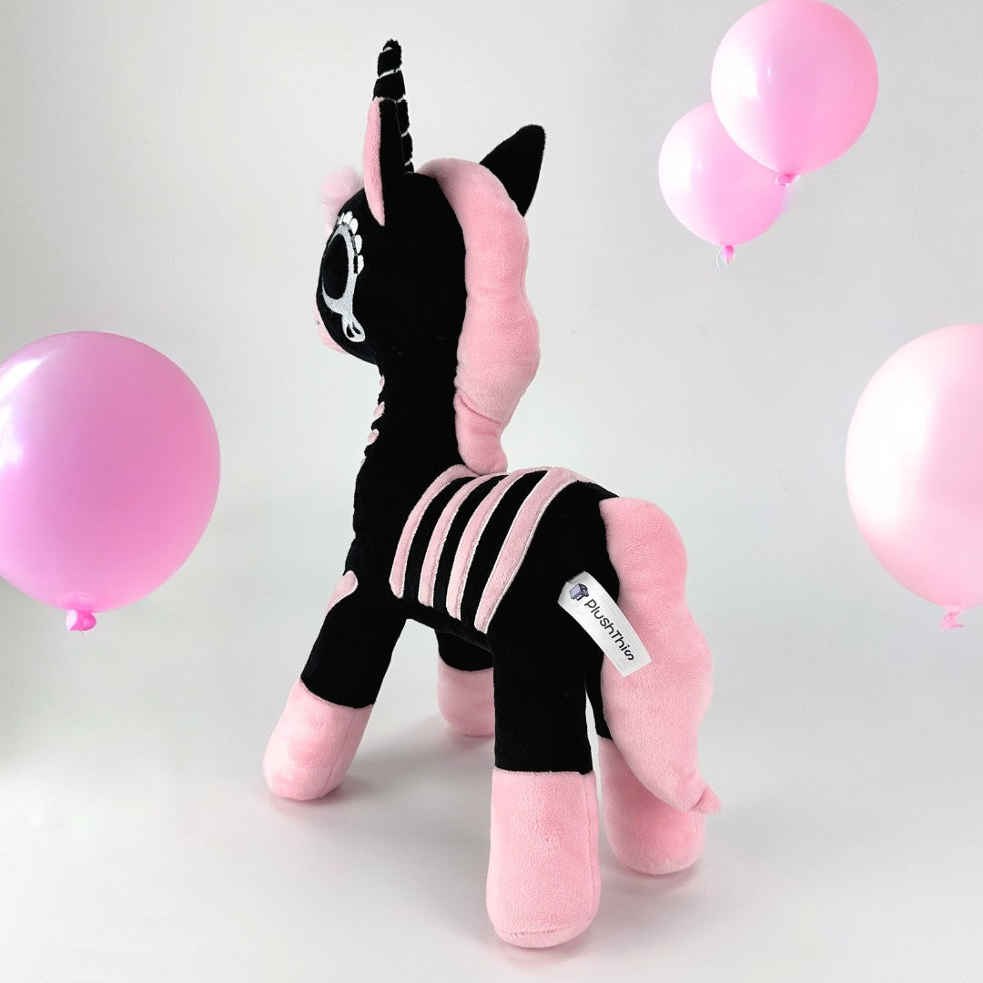 Pink skeleton unicorn plush toy