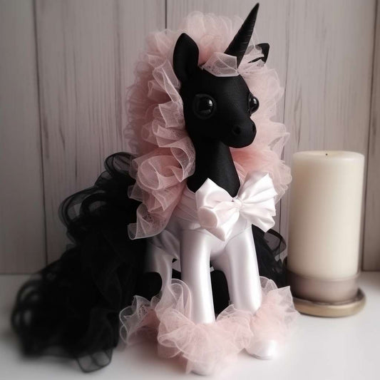 Pink and black unicorn stuffed animal