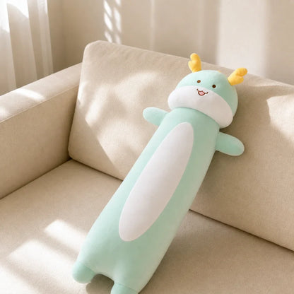 Mint Green Long Dragon Plush on a Cream Sofa