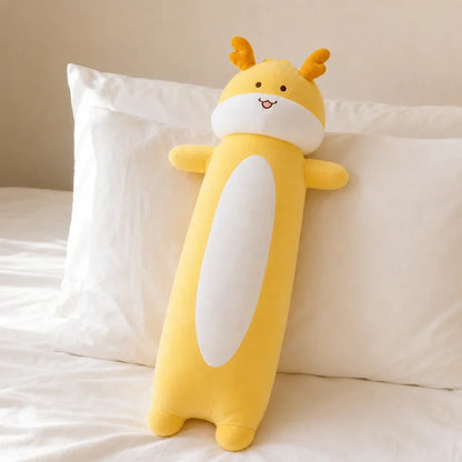 Yellow Long Dragon Plush on a White Bed