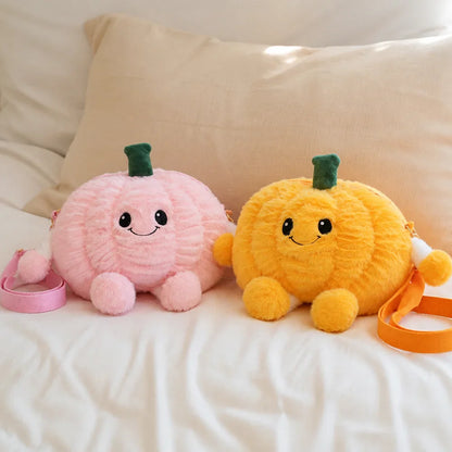 Pink and Yellow Pumpkin Plush Crossbody Bags on a Bed
