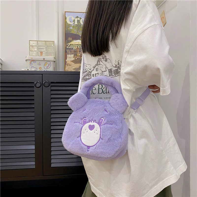 Blue Bear plush handbag with a heart-shaped patch, perfect for kids.