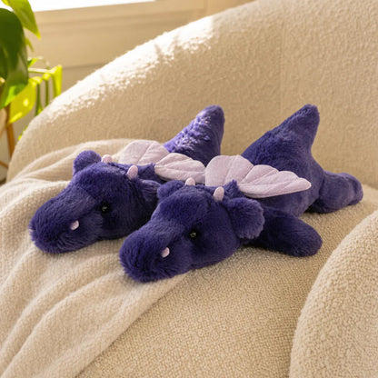 Two Dark Purple Dragon Plush Toys on a Cozy Sofa