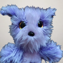 Front close-up of a purple mermaid dog plush with long lavender fur and large eyes.