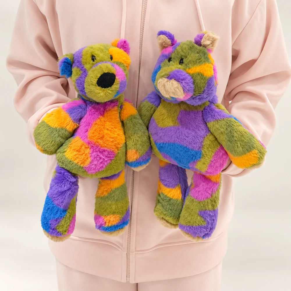 Rainbow bear and pig plush toys held side by side to show both animal styles.