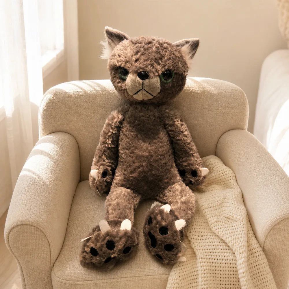 Gray Scowling Cat Plush on a Cozy Armchair
