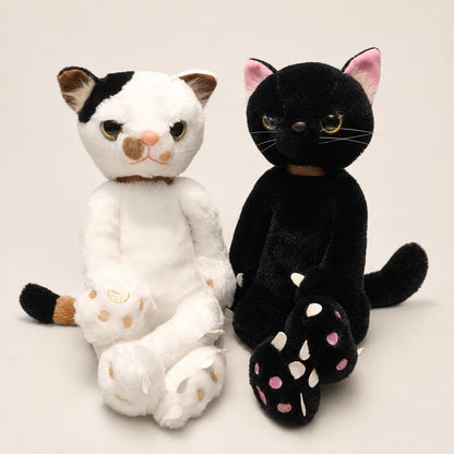 White and Black Scowling Cat Plushes – Front View
